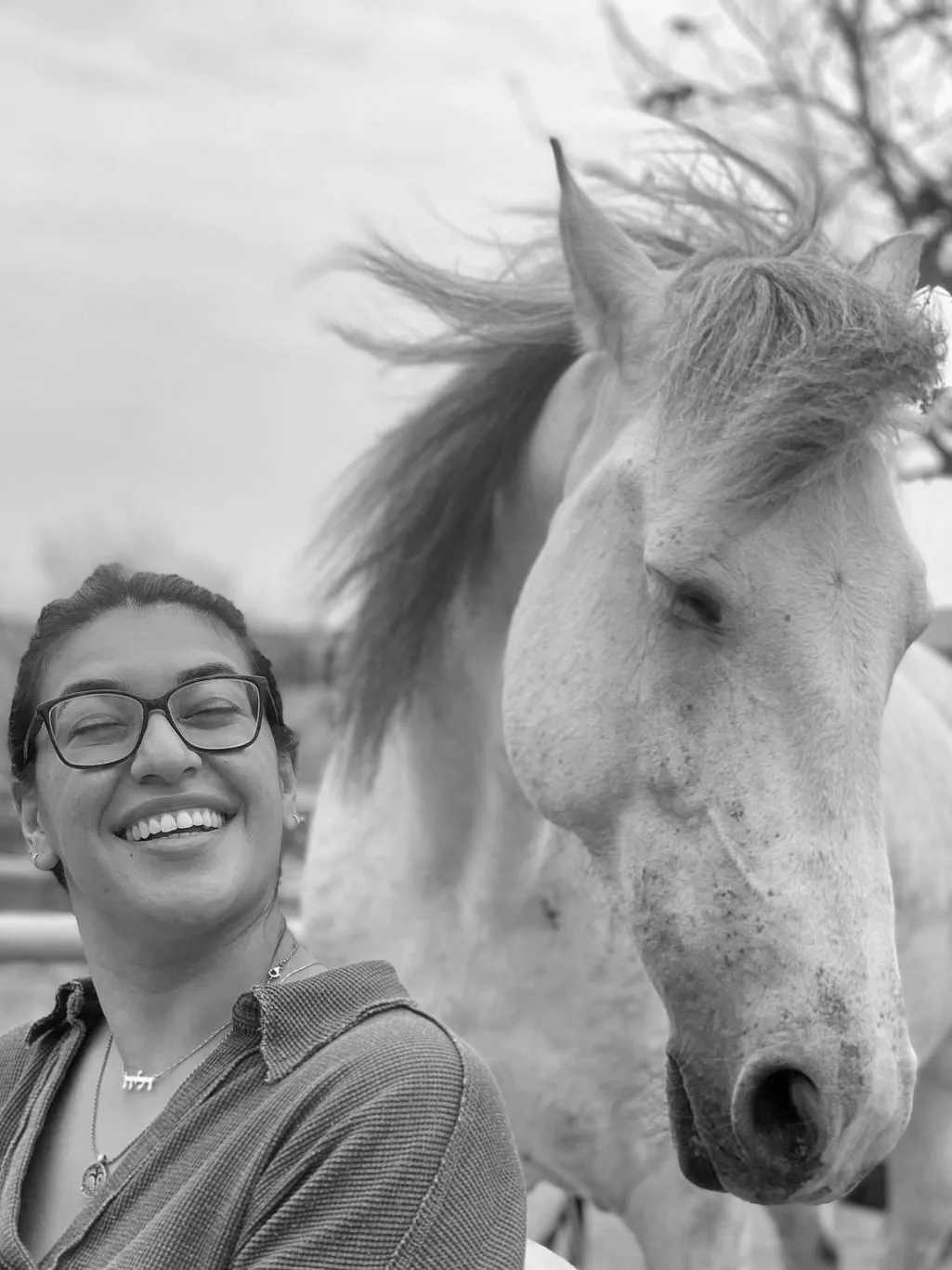Black-and-white portrait of a woman and a horse